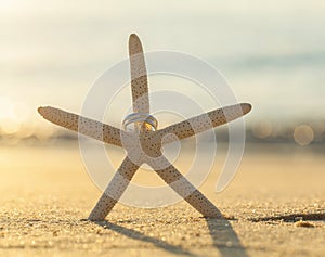 Wedding rings put on the beach.