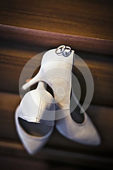 Wedding rings and shoes bride