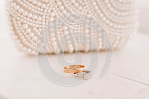 Wedding rings. Simple male ring and ring for a woman with a diamond. Close-up