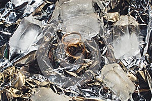 Wedding rings with splashes of water and pieces of ice. Wedding concept