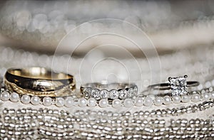 Wedding rings on sequins and pearls