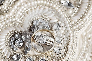 Wedding rings on sequins and pearls