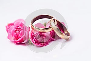 wedding rings with white background with flowers. Generative AI.