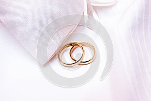 Wedding rings on white fabric