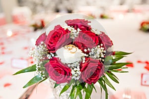 Wedding Rings on White and Red Roses Bridal Bouquet