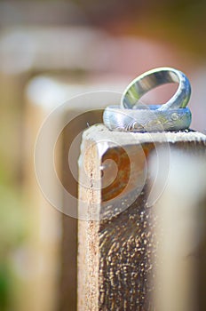 Wedding Rings On Wooden Fence