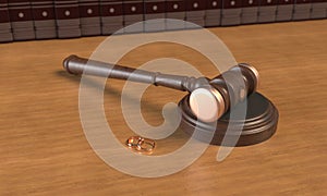 Wedding rings and a wooden gavel of judges on the table. Books in the background. 3d rendering