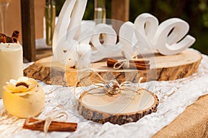 Wedding rings on wooden stump