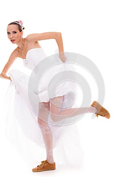 Wedding. Running bride funny woman in sport shoes