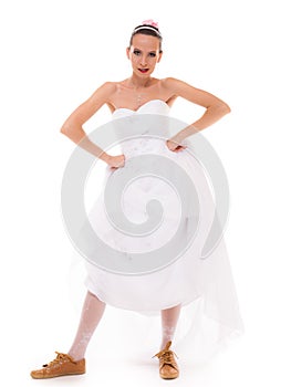 Wedding. Running bride funny woman in sport shoes