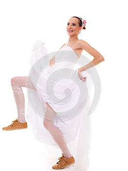 Wedding. Running bride funny woman in sport shoes