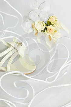 Wedding sandals and flowers over veil