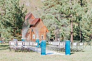 Wedding set up for an outdoor wedding ceremony. Chairs set up for an outdoor event. Decorated Outdoor Wedding ceremony