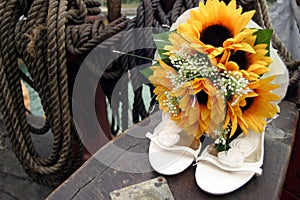 Wedding shoes and bouquet photo