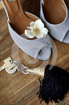 Wedding shoes and flower on the table