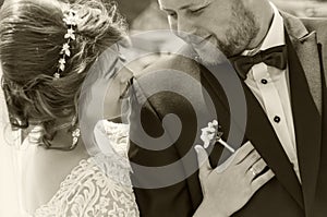 Wedding shot of the bride and groom close-up. Black and white ph