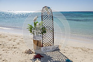 Wedding sign set up on a tropical beach paradise