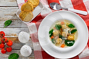 wedding soup with meatballs, small pasta risini,spinach and vegetables