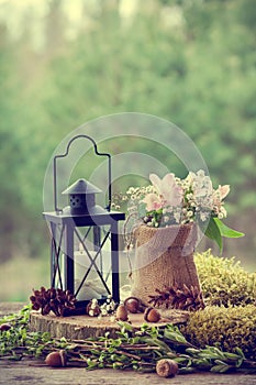 Wedding still life in rustic style. Forest on background.