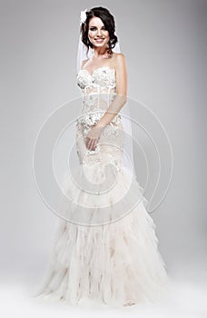 Wedding Style. Sophisticated Newlywed in White Bridal Dress. Elegance