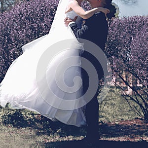 Wedding sweet couple kissing, bride and groom