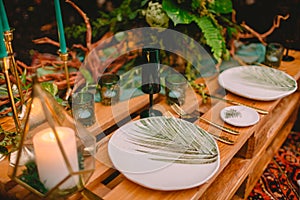 Wedding table, cutlery, candles and floristic. Wedding rustic dinner