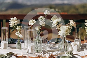 The wedding table decorated with fresh flowers.