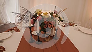 Wedding table decoration at a banquet in a beautiful white tent. camera movement slow