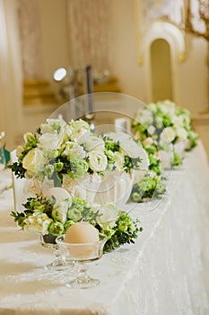 Wedding table decoration, wedding setting, wedding flowers on table, shallow depth of field