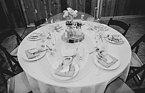 Wedding table decoration with the white candle and rustic accessories