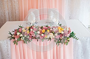 Wedding floristics. Decoration of a table fresh flowers. Wedding in pink color photo
