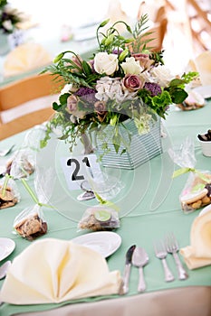 Wedding table with flower centerpiece photo