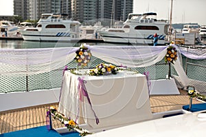 Wedding table flower settings in yacht