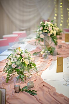 Wedding table with flowers and decorations, wedding centerpiece or event reception