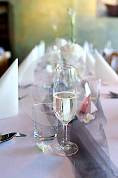 Wedding table with glass of white wine