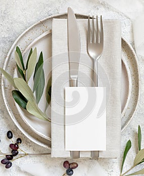 Wedding Table place with a card decorated with olive branches