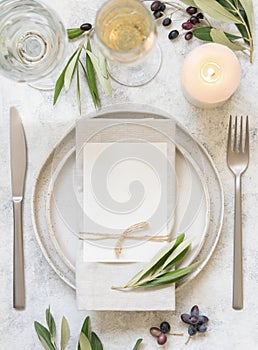 Wedding Table place with a card decorated with olive branches