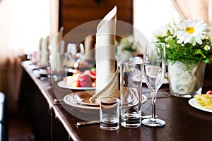 Wedding table in restaurant with flower composition