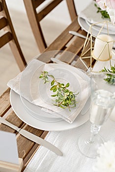 The wedding table setting and decor on wooden table in rustic style