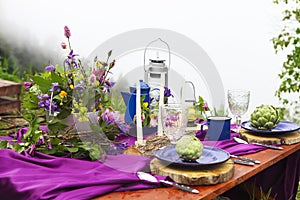 Wedding table setting decorated in rustic style