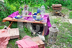 Wedding table setting decorated in rustic style. Wedding inspiration on mountain.