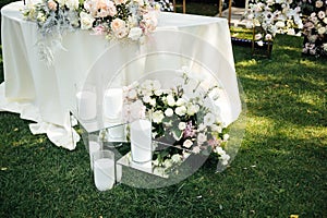 Wedding table setting for newlyweds. Festive table decorated with white plates and napkins.