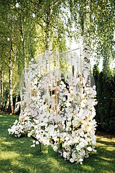 Wedding table setting for newlyweds. Festive table decorated with white plates and napkins.