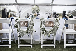 Wedding table under tent, with Mr and Mrs signs