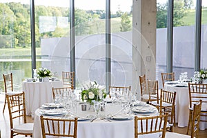 Wedding tables set for fine dining at a fancy catered event - wedding table series