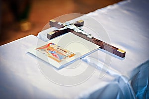 Wedding theme with religious book and wooden cross