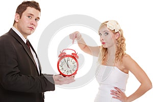 Wedding. Time to get married. Bride groom with clock.