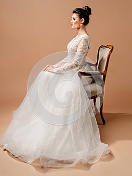 Wedding traditions. Gravely studio portrait on brown background. Marriage duty concept. photo