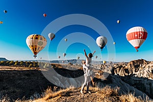 Wedding travel. Honeymoon trip. Couple in love among balloons. A guy proposes to a girl. Couple in love in Cappadocia. Couple in