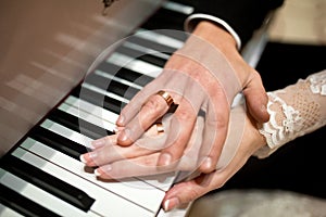 Wedding Two hands on piano keys